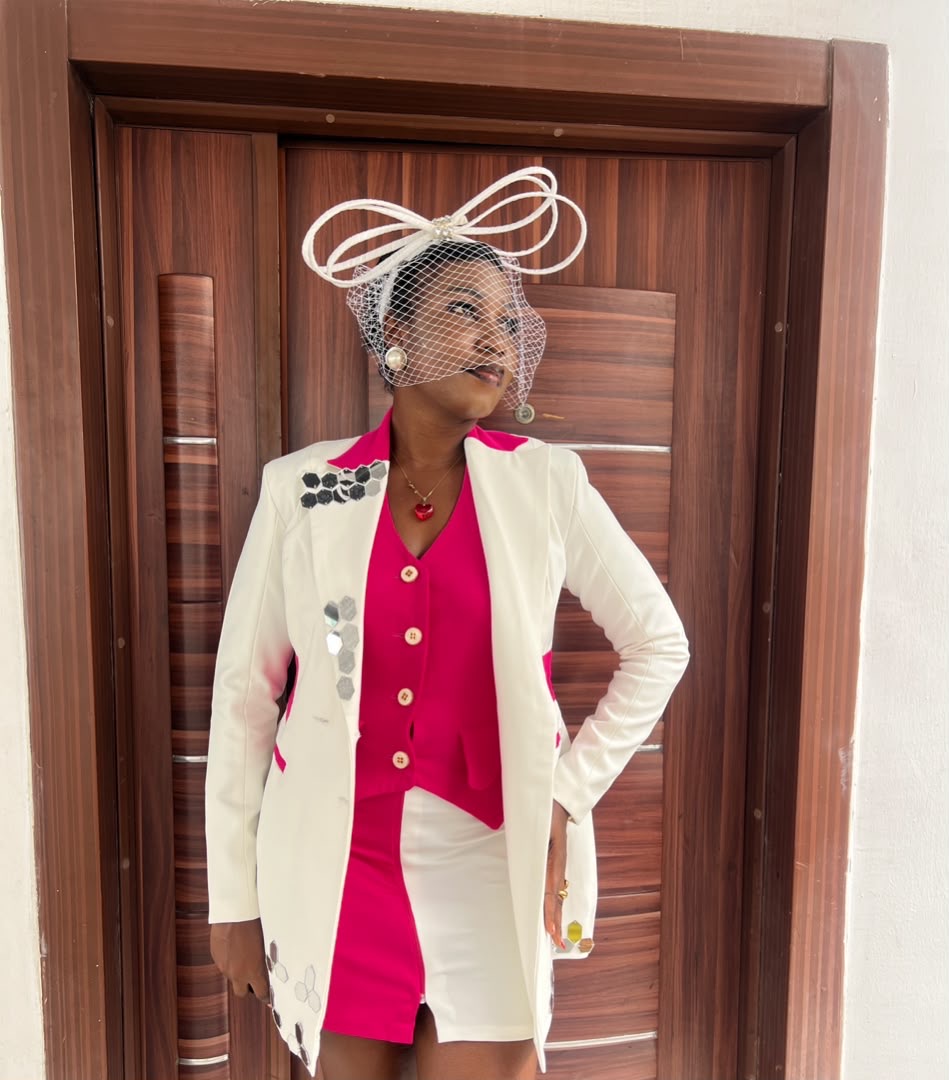 Two-tone skirt suit with sculptural headpiece