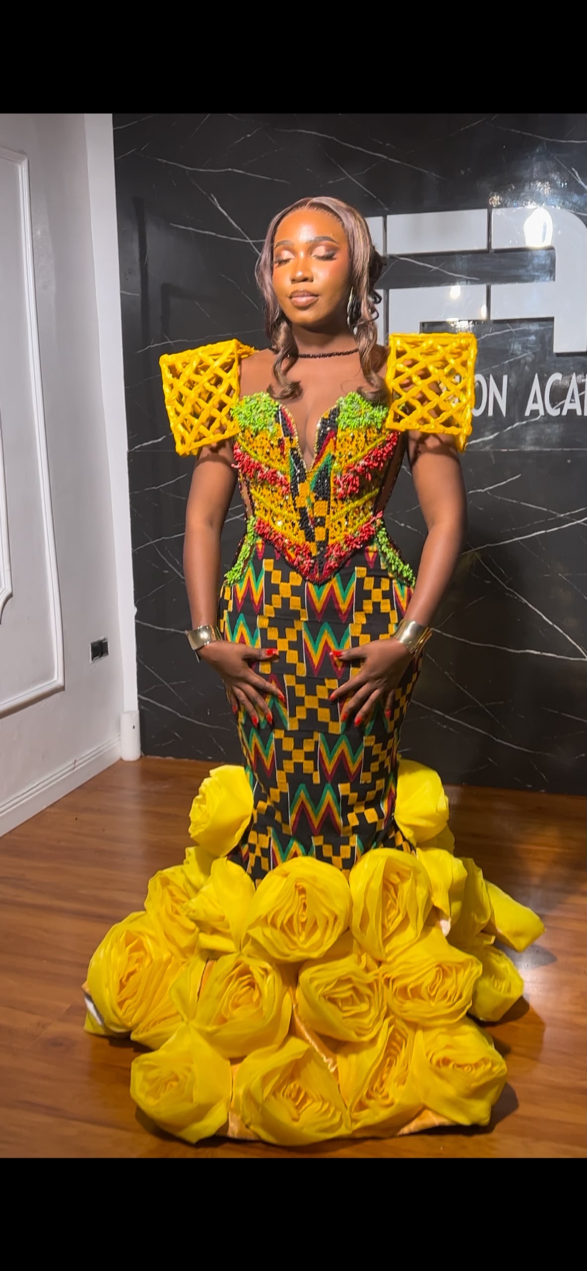Beaded kente gown with cage shoulder details